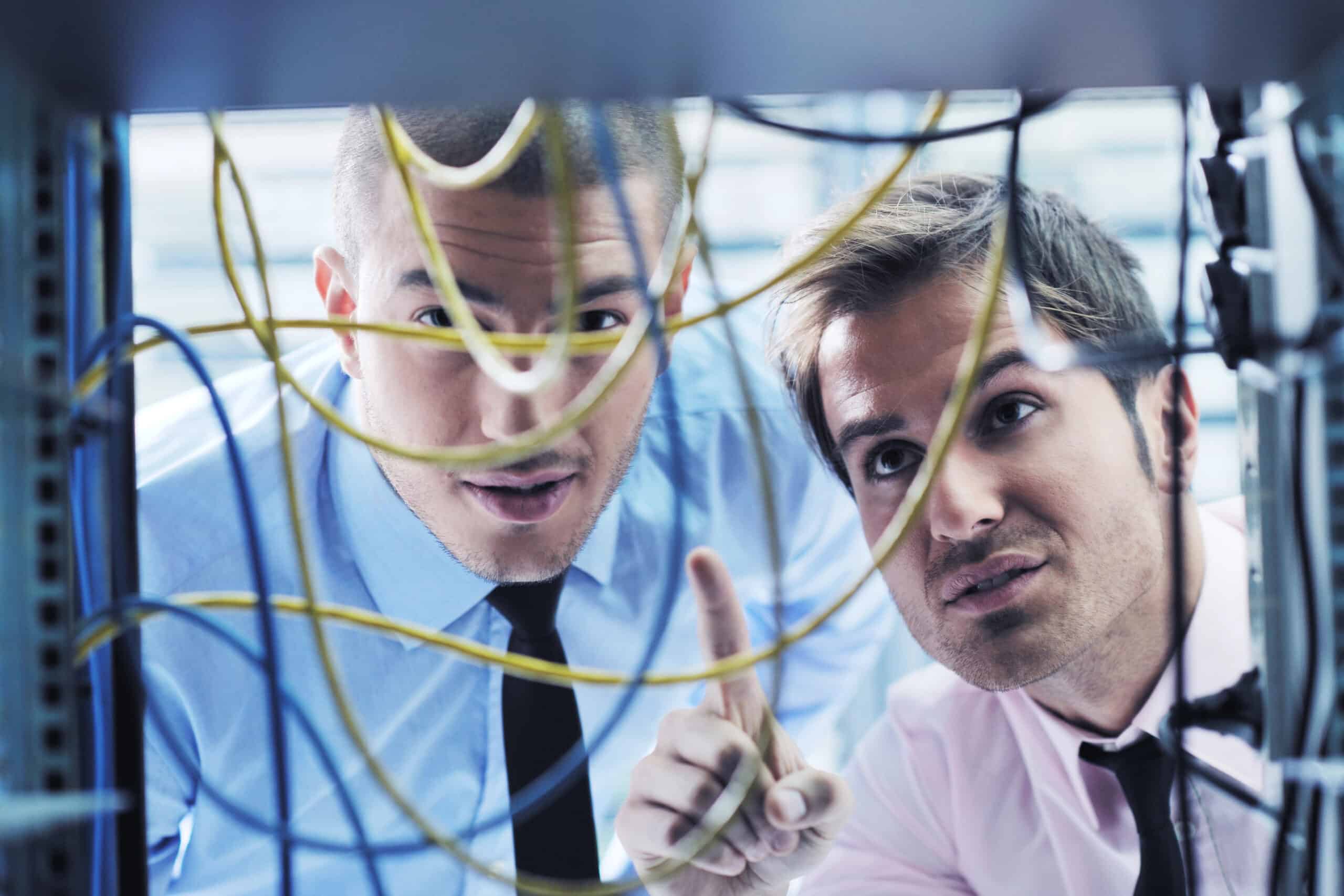 IT support experts working in a network server room of a non-profit 